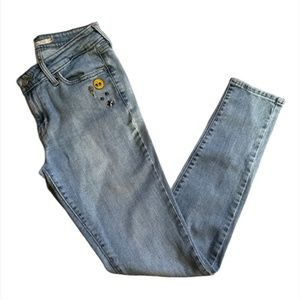 Levi’s 711 Skinny Jeans with Enamel Smiley Face and Stars